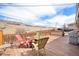Outdoor deck with seating and grill offering views of a hillside in a serene setting at 16805 W 16Th Pl, Golden, CO 80401