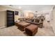 Finished basement featuring a large sectional sofa, ottomans, and a theater screen at 16805 W 16Th Pl, Golden, CO 80401