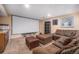 Cozy basement with a large screen, projector, comfortable seating, and carpet flooring at 16805 W 16Th Pl, Golden, CO 80401