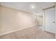 Spacious basement area with neutral carpeting, white trim, and a convenient mirrored sliding closet at 16805 W 16Th Pl, Golden, CO 80401