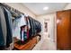 Walk-in closet with clothes rack, lighting, carpet, and access to other rooms at 16805 W 16Th Pl, Golden, CO 80401