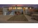 Charming home featuring a split-level design, garage, and quaint front porch seating area at 16805 W 16Th Pl, Golden, CO 80401