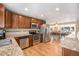 Well-lit kitchen features stainless steel appliances, granite countertops, and hardwood floors at 16805 W 16Th Pl, Golden, CO 80401
