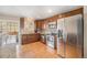 Updated kitchen features stainless steel appliances, granite counters, and ample cabinet space at 16805 W 16Th Pl, Golden, CO 80401