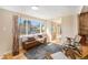 Cozy living area with large windows, hardwood floors and modern furnishings at 16805 W 16Th Pl, Golden, CO 80401