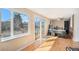 Bright office features a large window, glass doors to a deck and wood flooring at 16805 W 16Th Pl, Golden, CO 80401