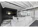 Finished basement area with a large TV, cozy seating, and modern design at 423 Rogers Way, Castle Rock, CO 80104