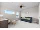 Cozy bedroom with natural light, ceiling fan and a comfortable daybed at 423 Rogers Way, Castle Rock, CO 80104