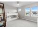 Bright bedroom featuring a white bunk bed, ceiling fan and plenty of natural light from the two windows at 423 Rogers Way, Castle Rock, CO 80104