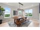 Bright dining room with large windows, a wooden table and rug at 423 Rogers Way, Castle Rock, CO 80104
