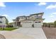Desirable two-story home with a two-car garage, manicured lawn, and an extended driveway at 423 Rogers Way, Castle Rock, CO 80104