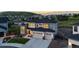 Stunning two-story home with a three-car garage, fenced in yard, and mountain views at 423 Rogers Way, Castle Rock, CO 80104