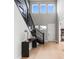 Elegant foyer showcasing staircase, wood floors, high ceilings, and decoratives at 423 Rogers Way, Castle Rock, CO 80104