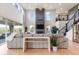 Bright living room features soaring ceilings, large windows and hardwood floors at 423 Rogers Way, Castle Rock, CO 80104
