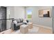 Living room area with a comfortable sofa, footrests, and a view to the outdoors at 423 Rogers Way, Castle Rock, CO 80104