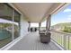 Covered patio with wicker furniture offering views of the surrounding neighborhood and mountains at 423 Rogers Way, Castle Rock, CO 80104