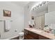 Bathroom with wood-look flooring, granite counters and ample lighting at 23346 E 5Th Pl # 101, Aurora, CO 80018