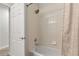 Clean bathroom featuring a shower/tub combination with light tile at 23346 E 5Th Pl # 101, Aurora, CO 80018