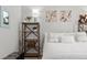 Bedroom features large bed and shelf decor at 23346 E 5Th Pl # 101, Aurora, CO 80018