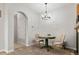 Cozy dining area featuring a green table, neutral chairs, and stylish lighting at 23346 E 5Th Pl # 101, Aurora, CO 80018