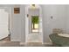 Inviting hallway featuring tiled floors, modern decor, and natural light streaming through an open door at 23346 E 5Th Pl # 101, Aurora, CO 80018