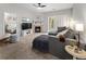 Cozy living room with fireplace, ceiling fan, and sliding doors to balcony at 23346 E 5Th Pl # 101, Aurora, CO 80018