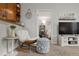 Charming living area showcasing a rocking chair, TV, and doorway to the bedroom at 23346 E 5Th Pl # 101, Aurora, CO 80018