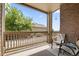 Charming, covered patio is an ideal spot for relaxation, featuring comfortable seating and a scenic view at 23346 E 5Th Pl # 101, Aurora, CO 80018