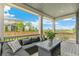 Cozy back porch with comfortable seating and a view of the surrounding landscape at 2520 Canfield Ln, Erie, CO 80026