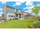 Green backyard with a well-maintained lawn, nice landscaping, and a view of the house at 2520 Canfield Ln, Erie, CO 80026