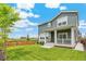 Expansive backyard with lush green grass and a privacy fence, perfect for outdoor activities at 2520 Canfield Ln, Erie, CO 80026