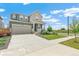 Charming home with a two-car garage, well-manicured lawn, and inviting curb appeal at 2520 Canfield Ln, Erie, CO 80026