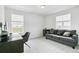 Comfortable living room space with modern furnishings and lots of natural light at 2520 Canfield Ln, Erie, CO 80026