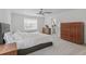 Spacious main bedroom with hardwood floors, large windows, and neutral decor at 2520 Canfield Ln, Erie, CO 80026