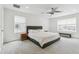Spacious main bedroom featuring a ceiling fan, a tufted headboard and bright natural light at 2520 Canfield Ln, Erie, CO 80026