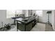 Well-lit office space with a large desk and music equipment creating a functional and inspiring workspace at 2520 Canfield Ln, Erie, CO 80026
