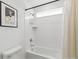 Bright shower and bathtub combination with a shower curtain at 2520 Canfield Ln, Erie, CO 80026