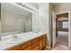 Bathroom features a large mirror, double sinks, and a shower stall at 13756 Legend Trl # 101, Broomfield, CO 80023