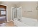 Bathroom boasts a soaking tub, glass enclosed shower, and natural light at 13756 Legend Trl # 101, Broomfield, CO 80023