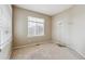 Bright bedroom with neutral carpet offering plenty of natural light and access to closet at 13756 Legend Trl # 101, Broomfield, CO 80023