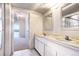 Bright bathroom with marble floors, double sink vanity, and an accessible bathroom at 130 N Pearl St # 1606, Denver, CO 80203