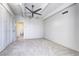 Bright bedroom featuring soft carpet, a ceiling fan, and an accessible bathroom at 130 N Pearl St # 1606, Denver, CO 80203