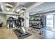 Well-equipped fitness center with various exercise machines and mirrored walls at 130 N Pearl St # 1606, Denver, CO 80203