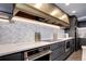 Modern kitchen with sleek countertops, backsplash, and stainless steel appliances at 130 N Pearl St # 1606, Denver, CO 80203