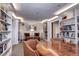 Library with bookshelves, comfortable seating, and warm lighting at 130 N Pearl St # 1606, Denver, CO 80203