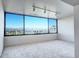 Spacious room with great views showcasing a floor to ceiling window, white walls and neutral carpeted floors at 130 N Pearl St # 1606, Denver, CO 80203