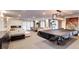 Large recreation room with a covered pool table, cozy seating, and modern décor at 130 N Pearl St # 1606, Denver, CO 80203