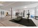 Spacious basement with workout equipment and plenty of room for activities at 4273 Ridgewalk Pt, Castle Rock, CO 80108