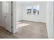 Bedroom featuring light-colored walls, luxury vinyl plank flooring, and two windows providing lots of light at 4273 Ridgewalk Pt, Castle Rock, CO 80108