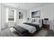 Elegant bedroom with modern furnishings, a plush bed, and minimalist decor at 4273 Ridgewalk Pt, Castle Rock, CO 80108